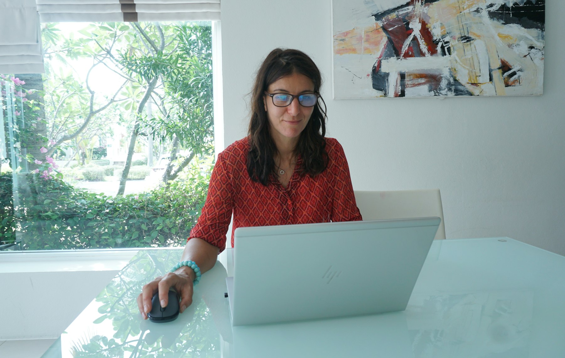 Professional working from a bright home office desk